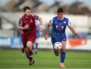4 July 2024; Enda Curran of Treaty United  in action against Dale Holland of Cobh Ramblers during the SSE Airtricity Men's First Division match between Treaty United and Cobh Ramblers at Markets Field in Limerick. Photo by Michael P Ryan/Sportsfile