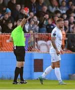 4 July 2024; Paddy Barrett of Shelbourne is shown a red card by referee Paul McLaughlin during the SSE Airtricity Men's Premier Division match between Drogheda United and Shelbourne at Weavers Park in Drogheda, Louth. Photo by Stephen McCarthy/Sportsfile