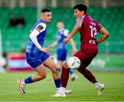 4 July 2024; Yoyo Mahdy of Treaty United in action against Nolan Evers of Cobh Ramblers during the SSE Airtricity Men's First Division match between Treaty United and Cobh Ramblers at Markets Field in Limerick. Photo by Michael P Ryan/Sportsfile
