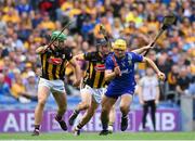 6 July 2024; Mark Rodgers of Clare in action against Kilkenny players, from left, Tommy Walsh and Mikey Butler during the GAA Hurling All-Ireland Senior Championship semi-final match between Kilkenny and Clare at Croke Park in Dublin. Photo by John Sheridan/Sportsfile