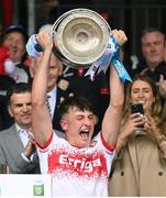 7 July 2024; Derry captain James Sargent lifts the trophy after the Electric Ireland GAA All-Ireland Football Minor Championship final match between Armagh and Derry at O'Neills Healy Park in Omagh, Tyrone. Photo by Ramsey Cardy/Sportsfile