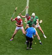 7 July 2024; Referee Thomas Walsh throws in the ball between Tim O'Mahony, left, and Darragh Fitzgibbon of Cork and Will O'Donoghue, left, and Cian Lynch of Limerick to start the GAA Hurling All-Ireland Senior Championship semi-final match between Limerick and Cork at Croke Park in Dublin. Photo by Daire Brennan/Sportsfile