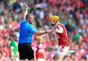 7 July 2024; Declan Dalton of Cork and referee Thomas Walsh during the GAA Hurling All-Ireland Senior Championship semi-final match between Limerick and Cork at Croke Park in Dublin. Photo by Stephen McCarthy/Sportsfile