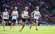 7 July 2024; The eventual winner Luke Houser, 101, University of Washington, NCAA Mile champion trails Sean Tobin, Clonmel AC Tipperary, with Shane Bracken, Swinford AC Mayo, in third place, and John Travers, Donore Harriers, Dublin, in 4th position, during the historic mile record attempt staged at Croke Park as part of the GAA’s Tailteann Games commemoration at half time of the GAA Hurling All-Ireland Senior Championship Semi-Final between Limerick and Cork. Photo by Ray McManus/Sportsfile