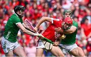 7 July 2024; Alan Connolly of Cork in action against Limerick players Declan Hannon, left, and Seán Finn during the GAA Hurling All-Ireland Senior Championship semi-final match between Limerick and Cork at Croke Park in Dublin. Photo by Seb Daly/Sportsfile