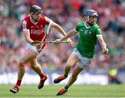 7 July 2024; David Reidy of Limerick and Robert Downey of Cork during the GAA Hurling All-Ireland Senior Championship semi-final match between Limerick and Cork at Croke Park in Dublin. Photo by Stephen McCarthy/Sportsfile