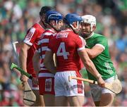 7 July 2024; Aaron Gillane of Limerick with Cork players, Sean O'Donoghue, 4, Patrick Collins, 1, and Eoin Downey during the GAA Hurling All-Ireland Senior Championship semi-final match between Limerick and Cork at Croke Park in Dublin. Photo by Stephen McCarthy/Sportsfile