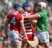 7 July 2024; Aaron Gillane of Limerick with Cork players, Sean O'Donoghue, 4, goalkeeper Patrick Collins and Eoin Downey during the GAA Hurling All-Ireland Senior Championship semi-final match between Limerick and Cork at Croke Park in Dublin. Photo by Stephen McCarthy/Sportsfile