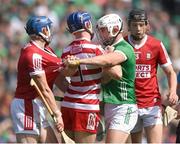 7 July 2024; Aaron Gillane of Limerick with Cork players, Sean O'Donoghue, 4, goalkeeper Patrick Collins and Eoin Downey, right, during the GAA Hurling All-Ireland Senior Championship semi-final match between Limerick and Cork at Croke Park in Dublin. Photo by Stephen McCarthy/Sportsfile