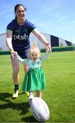 8 July 2024; Katie Heffernan with Ireland supporter Erin Molony, aged 2, from Mullingar in Westmeath, during the Team Ireland Paris 2024 team training for Rugby Sevens ahead of the Paris 2024 Olympic Games at the IRFU Outdoor Pitch on the Sport Ireland Campus in Dublin. Photo by Shauna Clinton/Sportsfile