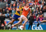 29 June 2024; Ross McQuillan of Armagh in action against Enda Smith of Roscommon during the GAA Football All-Ireland Senior Championship quarter-final match between Armagh and Roscommon at Croke Park in Dublin. Photo by Stephen McCarthy/Sportsfile