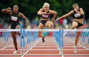 9 July 2024; Athletes, from left, Ebony Morrison of Liberia, Sarah Lavin of Ireland, and Talie Bonds of USA, competing in the Athletics Ireland 100m Hurdles final during the Cork City Sports at MTU Athletics Track in Cork. Photo by Tyler Miller/Sportsfile