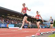 9 July 2024; Faye Mannion of Ennis Track A.C., Clare, celebrates after crossing the finish line to win the Cork Athletics 800m Junior women's final during the Cork City Sports at MTU Athletics Track in Cork. Photo by Tyler Miller/Sportsfile