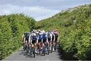 11 July 2024; The peloton during stage three of the 2024 Junior Tour of Ireland at the Burren stage in Clare. Photo by Stephen McMahon/Sportsfile