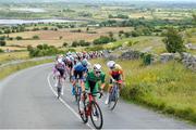 11 July 2024; Max Fitzgerald of Cycling Ireland team leads the peloton during stage three of the 2024 Junior Tour of Ireland at the Burren stage in Clare. Photo by Stephen McMahon/Sportsfile