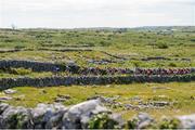 11 July 2024; The peloton during stage three of the 2024 Junior Tour of Ireland at the Burren stage in Clare. Photo by Stephen McMahon/Sportsfile