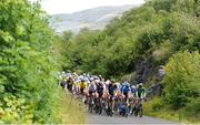 11 July 2024; The peloton during stage three of the 2024 Junior Tour of Ireland at the Burren stage in Clare. Photo by Stephen McMahon/Sportsfile