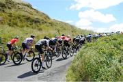 11 July 2024; The peloton on the category one climb of Castle Hill during stage three of the 2024 Junior Tour of Ireland at the Burren stage in Clare. Photo by Stephen McMahon/Sportsfile