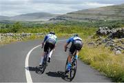 11 July 2024; Jake Speed of O’Leary Stone Kanturk and Chandler Evans of Hot Tubes team during stage three of the 2024 Junior Tour of Ireland at the Burren stage in Clare. Photo by Stephen McMahon/Sportsfile