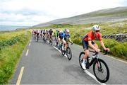 11 July 2024; Nick Makin of Mid Devon RC team leads the peloton during stage three of the 2024 Junior Tour of Ireland at the Burren stage in Clare. Photo by Stephen McMahon/Sportsfile