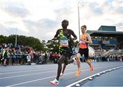 12 July 2024; Amos Langat of Kenya left, on his way to winning the Albie Thomas Family/ Dublin Athletics Board Men's 5000m ahead of Nick Griggs of Ireland who finished second with a new PB of 13:13.07 during the Morton Games at Morton Stadium in Dublin. Photo by Sam Barnes/Sportsfile