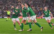 12 July 2024; Julie-Ann Russell of Republic of Ireland, centre, celebrates with teammates Aoife Mannion and Megan Campbell after scoring her side's first goal during the 2025 UEFA Women's European Championship qualifying group A match between England and Republic of Ireland at Carrow Road in Norwich, England. Photo by Stephen McCarthy/Sportsfile