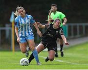 13 July 2024; Caleigh Boeckx of Treaty United is tackled by Amber Cosgrove of DLR Waves during the SSE Airtricity Women's Premier Division match between DLR Waves and Treaty United at UCD Bowl in Belfield, Dublin. Photo by Thomas Flinkow/Sportsfile