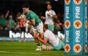 13 July 2024; Conor Murray of Ireland scores his side's first try despite the attentions of Pieter-Steph du Toit of South Africa during the second test between South Africa and Ireland at Kings Park in Durban, South Africa. Photo by Brendan Moran/Sportsfile