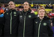 12 July 2024; Republic of Ireland head coach Eileen Gleeson, right, stands with her coaches Emma Byrne and Colin Healy during the playing the the national anthem before 2025 UEFA Women's European Championship qualifying group A match between England and Republic of Ireland at Carrow Road in Norwich, England. Photo by Stephen McCarthy/Sportsfile