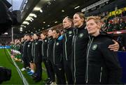 12 July 2024; Republic of Ireland head coach Eileen Gleeson stands with her coaches and staff, including Emma Byrne, Colin Healy and Ivi Casagrande during the playing the the national anthem before 2025 UEFA Women's European Championship qualifying group A match between England and Republic of Ireland at Carrow Road in Norwich, England. Photo by Stephen McCarthy/Sportsfile