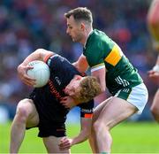 13 July 2024; Conor Turbitt of Armagh is tackled by Tom O'Sullivan of Kerry during the GAA Football All-Ireland Senior Championship semi-final match between Armagh and Kerry at Croke Park in Dublin. Photo by Ray McManus/Sportsfile