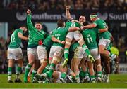 13 July 2024; Ireland players celebrate after teammate Ciarán Frawley, hidden, kicked their side's winning drop goal in the last seconds of the second test between South Africa and Ireland at Kings Park in Durban, South Africa. Photo by Brendan Moran/Sportsfile