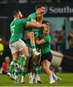 13 July 2024; Ciarán Frawley of Ireland, 22, celebrates with teammates after kicking their side's winning drop goal in the last seconds of the second test between South Africa and Ireland at Kings Park in Durban, South Africa. Photo by Brendan Moran/Sportsfile