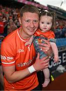13 July 2024; Armagh goalkeeper Blaine Hughes with his nine month old daughter, Mallaidh, after the GAA Football All-Ireland Senior Championship semi-final match between Armagh and Kerry at Croke Park in Dublin. Photo by Ray McManus/Sportsfile