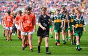 13 July 2024; Referee Tommy Brady, Abbeycartron NS, Elphin, Roscommon, leads the teams off after the GAA INTO Cumann na mBunscol Respect Exhibition Go Games at the GAA Football All-Ireland Senior Championship Semi-Final match between Armagh and Kerry at Croke Park in Dublin. Photo by Seb Daly/Sportsfile