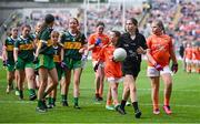 13 July 2024; Referee Aoibhinn Cox, Cootehall NS, Boyle, Roscommon, leads the teams off after the GAA INTO Cumann na mBunscol Respect Exhibition Go Games at the GAA Football All-Ireland Senior Championship Semi-Final match between Armagh and Kerry at Croke Park in Dublin. Photo by Seb Daly/Sportsfile