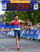 14 July 2024; Hugh Armstrong of Ballina AC, Mayo, crosses the line to win the Irish Life Dublin Race Series Fingal 10k at Swords in Dublin. Photo by Sam Barnes/Sportsfile