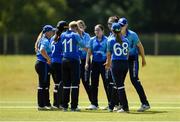 14 July 2024; Typhoons players celebrate the taking of the wicket of Alice Tector of Scorchers during the Evoke Super 20 Trophy Super Series match between Typhoons and Scorchers at Malahide Cricket Ground in Dublin. Photo by Tom Beary/Sportsfile