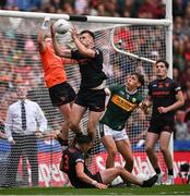 13 July 2024; Rian O'Neill of Armagh catches a late ball into the square ahead of teammate and goalkeeper Blaine Hughes, left, and Kerry's David Clifford during the GAA Football All-Ireland Senior Championship semi-final match between Armagh and Kerry at Croke Park in Dublin. Photo by Seb Daly/Sportsfile