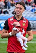 13 July 2024; Ryan Johnston of Down celebrates with with his daughter Thea, 1 month old, after victory in the Tailteann Cup Final match between Down and Laois at Croke Park in Dublin. Photo by Piaras Ó Mídheach/Sportsfile