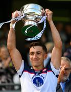 14 July 2024; Dylan Curran of New York lifts the cup after the GAA Football All-Ireland Junior Championship final between London and New York at Croke Park in Dublin. Photo by Ray McManus/Sportsfile