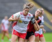 14 July 2024; Aoibhinn McHugh of Tyrone in action against Erin Sands of Down during the TG4 All-Ireland Intermediate Championship semi-final match between Down and Tyrone at St Tiernach's Park in Clones, Monaghan. Photo by Oliver McVeigh/Sportsfile