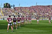 14 July 2024; Galway players stand for a minute's silence for the late John O'Mahony, former Galway, Mayo and Leitrim senior football manager, before the GAA Football All-Ireland Senior Championship semi-final match between Donegal and Galway at Croke Park in Dublin. Photo by Piaras Ó Mídheach/Sportsfile