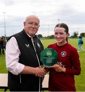 14 July 2024; Kerri O'Driscoll of Athenry receives the Player of the Match award from FAI Director of Competitions Fran Gavin after the FAI Women's Under 17 Cup final match between Athenry and Killester Donnycarney FC at Mullingar Athletic FC in Gainstown, Westmeath. Photo by Michael P Ryan/Sportsfile