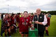 14 July 2024; Athenry captain Kerri O'Driscoll receives the cup from FAI Director of Competitions Fran Gavin after the FAI Women's Under 17 Cup final match between Athenry and Killester Donnycarney FC at Mullingar Athletic FC in Gainstown, Westmeath. Photo by Michael P Ryan/Sportsfile