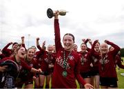 14 July 2024; Athenry captain Kerri O'Driscoll lifts the cup afyter the FAI Women's Under 17 Cup final match between Athenry and Killester Donnycarney FC at Mullingar Athletic FC in Gainstown, Westmeath. Photo by Michael P Ryan/Sportsfile