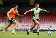 14 July 2024; Eva Mangan and Abbie Larkin, left, during a Republic of Ireland women's training session at Turners Cross in Cork Photo by Stephen McCarthy/Sportsfile