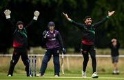 14 July 2024; Amish Sidhu of Phoenix, right and wicketkepper Adam Chester celebrate the wicket of Max Burton of CIYMS during the Cricket Ireland Irish Senior Cup semi-final match between Phoenix and CIYMS at Phoenix Park in Dublin. Photo by Harry Murphy/Sportsfile