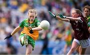 14 July 2024; Molly Maher, Scoil an Chroí Ró-Naofa, Urlingford, Kilkenny, representing Donegal, in action against Clodagh Buckley, Spa NS, Tralee, Kerry, representing Galway, during the GAA INTO Cumann na mBunscol Respect Exhibition Go Games at the GAA Football All-Ireland Senior Championship semi-final match between Donegal and Galway at Croke Park in Dublin. Photo by Seb Daly/Sportsfile