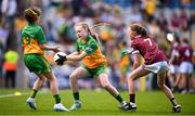 14 July 2024; Molly Maher, Scoil an Chroí Ró-Naofa, Urlingford, Kilkenny, representing Donegal, in action against Clodagh Buckley, Spa NS, Tralee, Kerry, representing Galway, during the GAA INTO Cumann na mBunscol Respect Exhibition Go Games at the GAA Football All-Ireland Senior Championship semi-final match between Donegal and Galway at Croke Park in Dublin. Photo by Seb Daly/Sportsfile